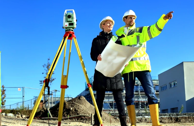 Surveyors discussing building plans